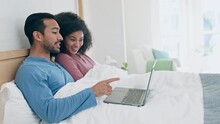 Happy, love and couple in a bed with laptop for movie, streaming or comedy streaming. Relax, bond and man with woman online in a bedroom with social media, video or laugh at gif comic, meme or blog