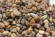 Background of little dark, brown, red and yellow stones close up view