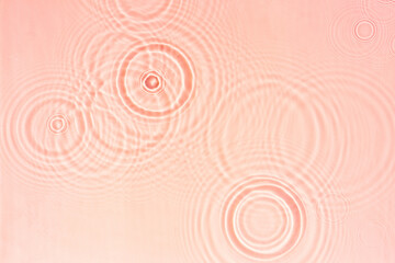 Wall Mural - Transparent pink clear water surface texture with ripples, splashes