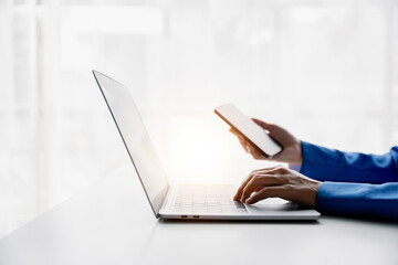 Wall Mural - type search information from the internet network. businessman working with smartphone, tablet and l
