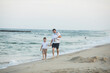 © Maria - Father and child playing on tropical beach at sunset. Family summer vacation at sea resort. Dad playing with kids on sunny evening at ocean shore. Travel with children. Parent love