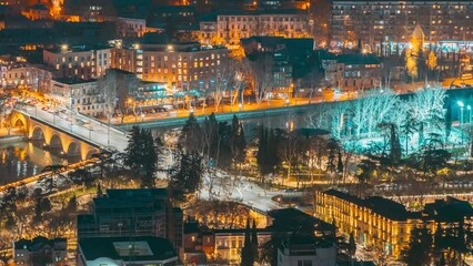 Wall Mural - Tbilisi, Georgia. hypelapse Elevated top Scenic View city night traffic. Georgian Capital Skyline Cityscape Night Time lapse timelapse.