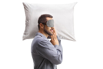 Poster - Man in pajamas sleeping with a mask on a pillow