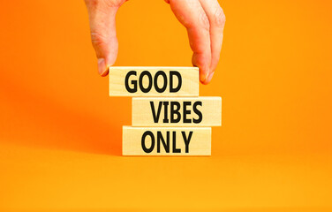 Wall Mural - Good vibes only symbol. Concept word Good vibes only on beautiful wooden block. Businessman hand. Beautiful orange table orange background. Business motivational good vibes only concept. Copy space.