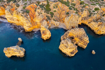 Wall Mural - Ponta da Piedade, Algarve, Portugal. Natural beach and cliffs. Aerial drone view