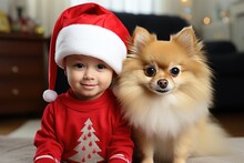 Cute Little Boy In A Santa Suit With A Spitz. Christmas Card With Dog And Child