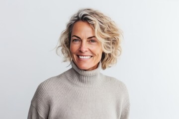 Canvas Print - Medium shot portrait photography of a French woman in her 40s wearing a cozy sweater against a white background