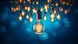 Creative tungsten light bulb lit on dark blue background
