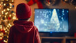 boy dressed as santa claus, using computer at christmas
