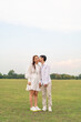 © topntp - Happy young Asian couple in bride and groom clothing