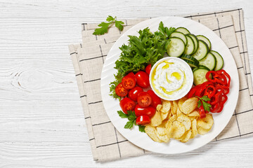 Wall Mural - Potato Chips, leafy greens, veggies snack platter