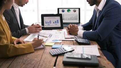 Wall Mural - Businessmen teamwork meeting to discuss the investment, Asian business adviser meeting to analyze and discuss the situation on the financial report in the meeting room.