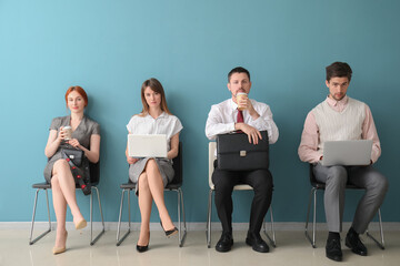 Wall Mural - Young applicants waiting for job interview in room