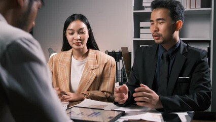 Wall Mural - Businessmen teamwork meeting to discuss the investment, Asian business adviser meeting to analyze and discuss the situation on the financial report in the meeting room.