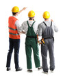 © Pixel-Shot - Team of male builders on white background, back view