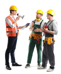 Wall Mural - Team of male builders on white background