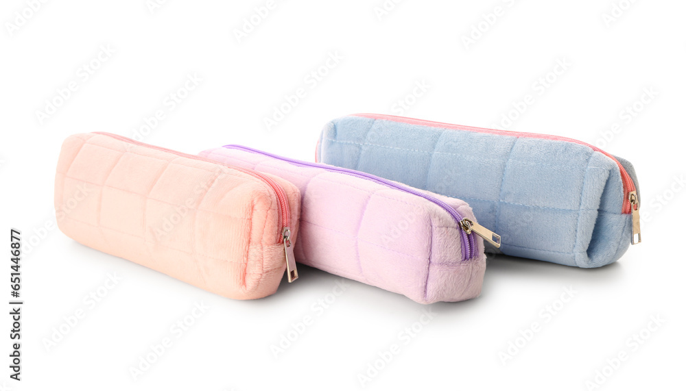 Pencil cases on white background