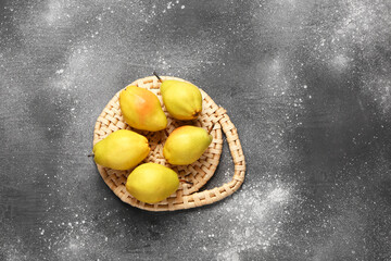 Many fresh pears on grey background