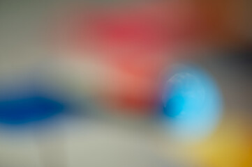 Wall Mural - Red, yellow, gray, blue and light abstract blurry gradient background.