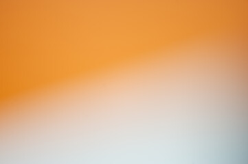 Wall Mural - Orange and white abstract blurry background.