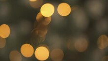 Defocused Rays Of Light Help Create A Spectacular Backdrop For Your Christmas And New Year Videos, Giving Them A Festive Mood. Christmas Tree And Light Garland Defocused