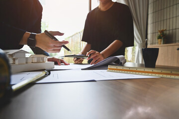 Cropped image of architects team working on project ,collaborating, planning working together in office