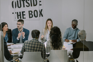 Multiracial teamwork in a modern meeting office