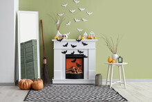 Interior Of Living Room Decorated For Halloween With Fireplace And Paper Bats