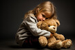 A solitary child hugging a teddy bear for comfort isolated on a white background 