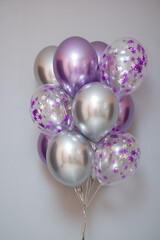 Wall Mural - set of purple chrome balloons on wall background