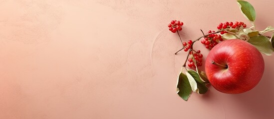 Wall Mural - Isolated ripe apple with vine wreath macro on a isolated pastel background Copy space