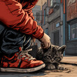 Lonely teenager hanging out on the street with a stray kitten. Unrecognizable kid sitting on the road and petting a cat