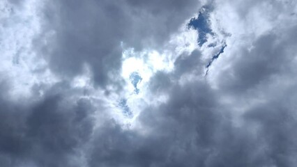 the dark cloudy sky finally clears and the light arrives