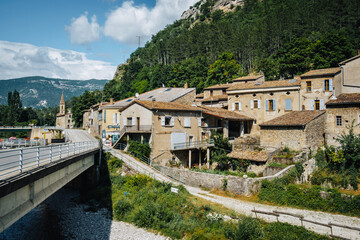 Wall Mural - Bridge over the Drome river and houses of the small medieval village of Pontaix, in the south of France (Drome)