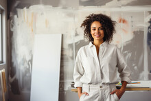 Portrait of beautiful multiracial house painter female in renovation room. Decoration and improvement interior.