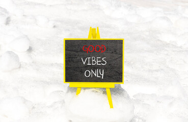 Wall Mural - Good vibes only symbol. Concept word Good vibes only on beautiful black chalk blackboard. White snow. Beautiful white snow background. Business motivational good vibes only concept. Copy space.