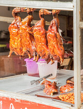 Street Vendor Selling Roasted Duck And Other Chinese Favorite Foods