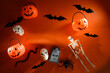 Assorted halloween items. Toys, jack-o-lantern buckets, skeletons, skulls, spiders, bats an snakes