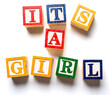 Children' blocks spelling out it's a girl. Birth or gender announcement