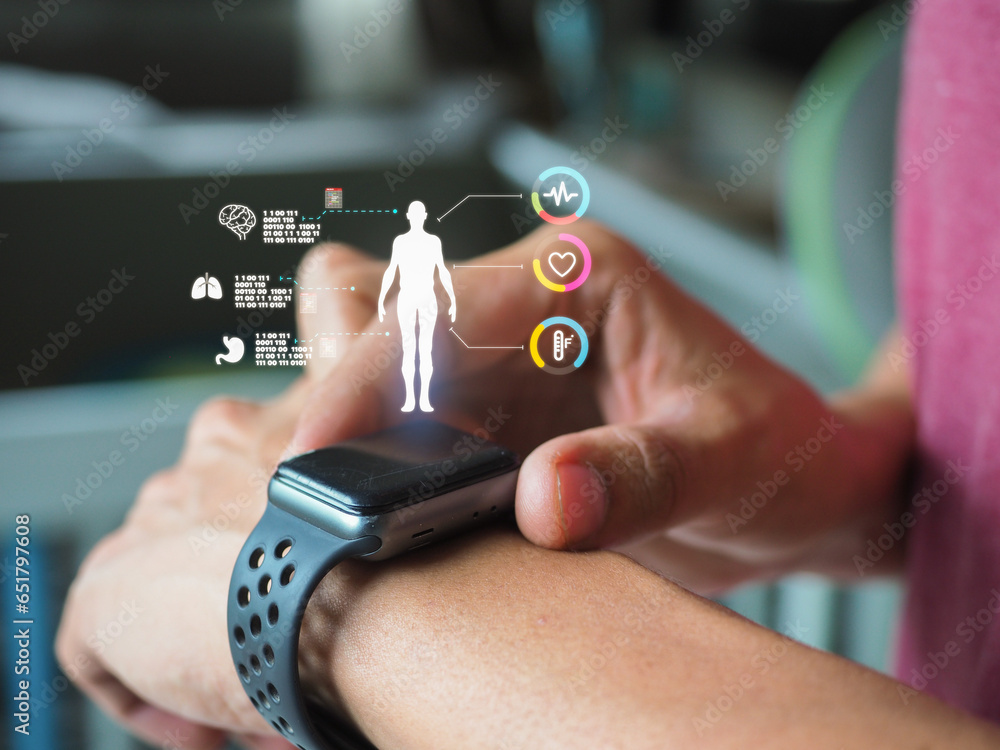Someone Using A Smart Watch Mid adult man using smart watch during training. Heart monitor beats ...