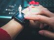 © woravut - woman using smart watch during training. Heart monitor beats with wristwatch. smart watch or future data on healthcare.