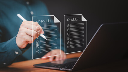 Business performance checklist. Businessman using laptop doing online checklist survey, digital form online exam, take an assessment, questionnaire, documentation database and process manage files.