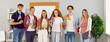 Group of cheerful international university students representing their countries holding flags. Six male and female students in classroom stand in row and smile at camera. Panoramic web banner.