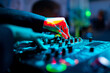 © pavel siamionov - woman DJ Hands creating and regulating music on dj console mixer in concert