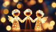 Cute christmas angels with lights and copy space
