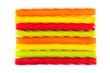 Sticker - Multicolored jelly candies in the shape of the sticks on a white background