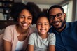 Portrait of happy mature couple with child relaxing on sofa at home. Middle aged black woman with husband and children smiling and looking at camera. beautiful family.