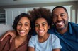 Portrait of happy mature couple with child relaxing on sofa at home. Middle aged black woman with husband and children smiling and looking at camera. beautiful family.
