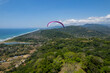 Aerial View of extreme paragliding sport in the Beautiful beach in Dominical - Costa Rica 