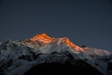 Mountain Peak In The Snow At Sunset Light